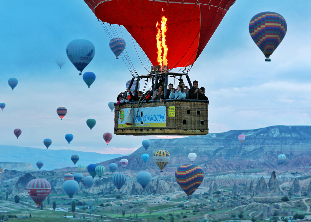 People Flying in a Hot Air Balloon Over Cappadocia 